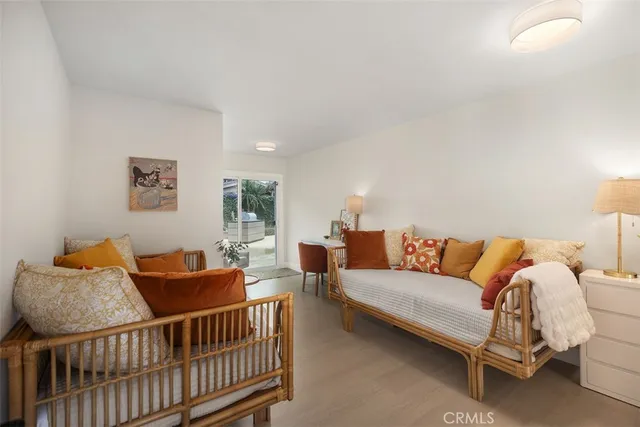 a view of a livingroom with furniture and a mirror