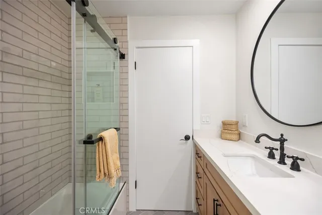 a bedroom with a bed and a potted plant