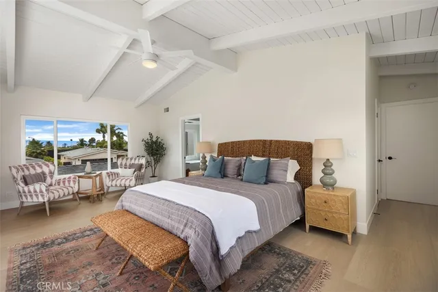 a living room with furniture tv and a large window