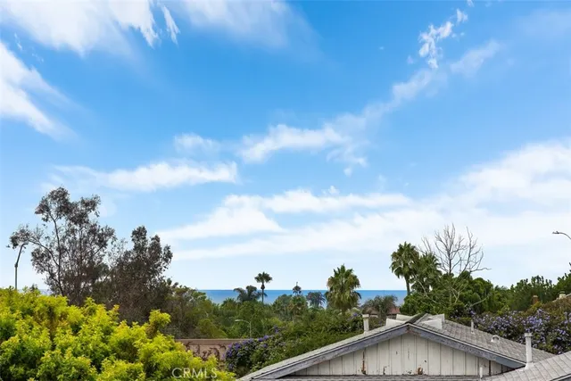 a view of a white house with swimming pool