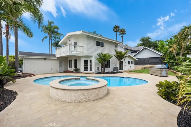 a view of a swimming pool with a patio