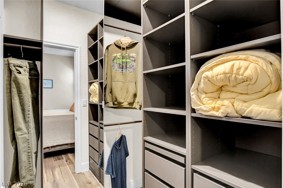 9688 Rankin Rdg Court Las Vegas, NV 89178 - Photo 29 of 53 A well-organized walk-in closet offers extensive storage solutions with shelving and hanging space.