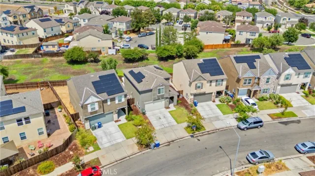 an aerial view of a house with a swimming pool yard and outdoor seating