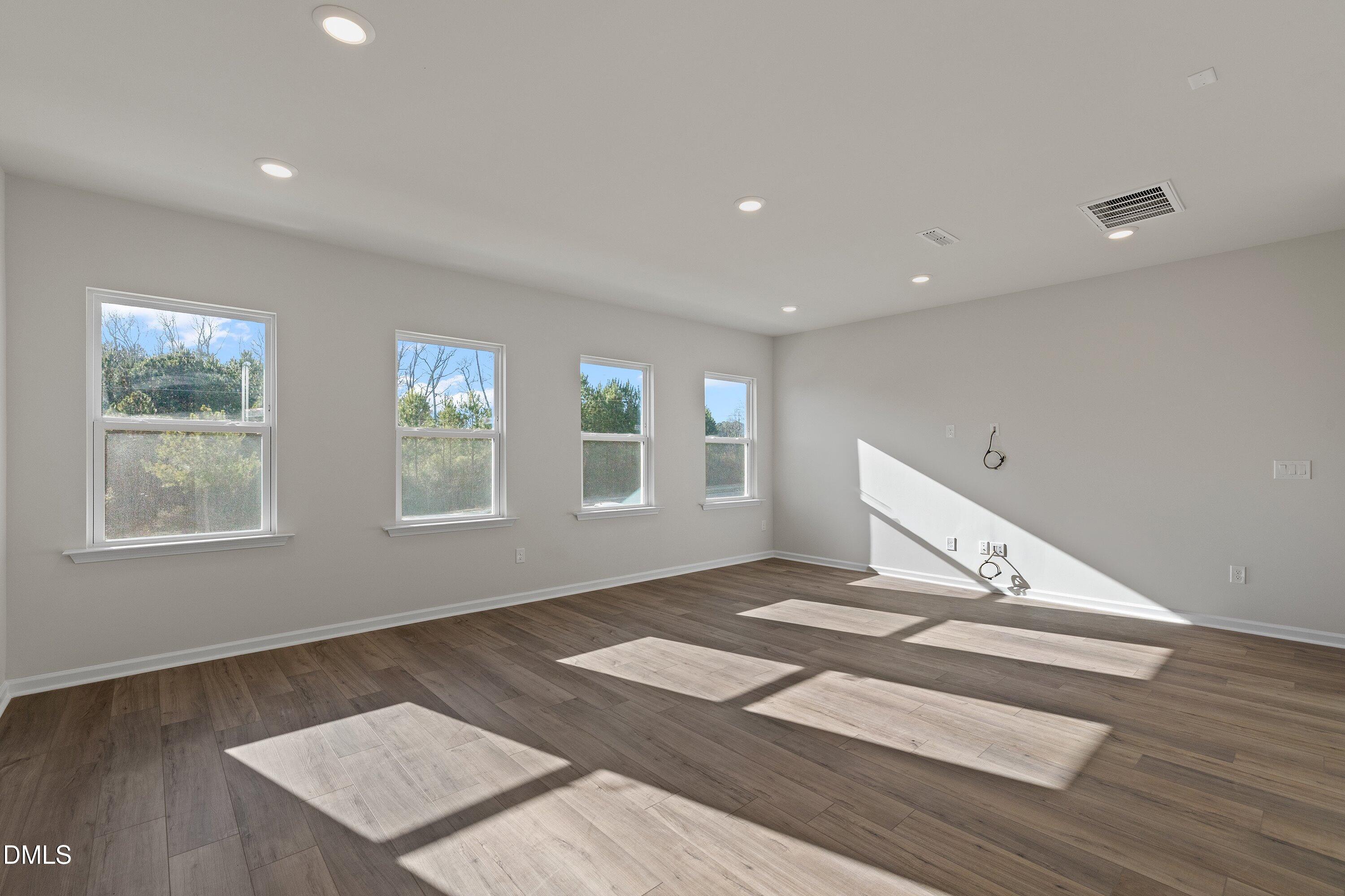 7242 Morris Acres Road Apex, NC 27523 - Photo 14 of 35 a view of an empty room with a window