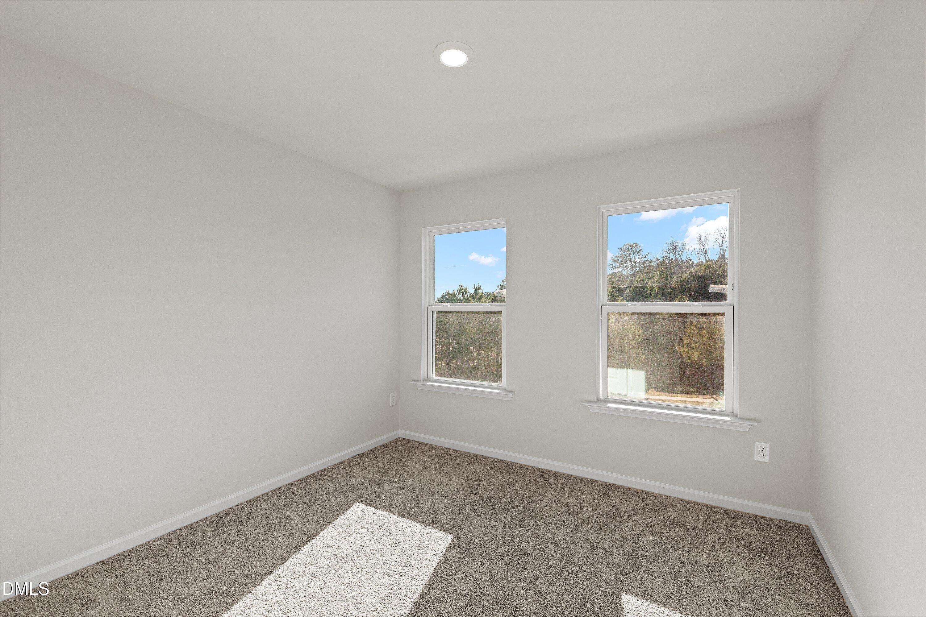 7242 Morris Acres Road Apex, NC 27523 - Photo 31 of 35 an empty room with windows