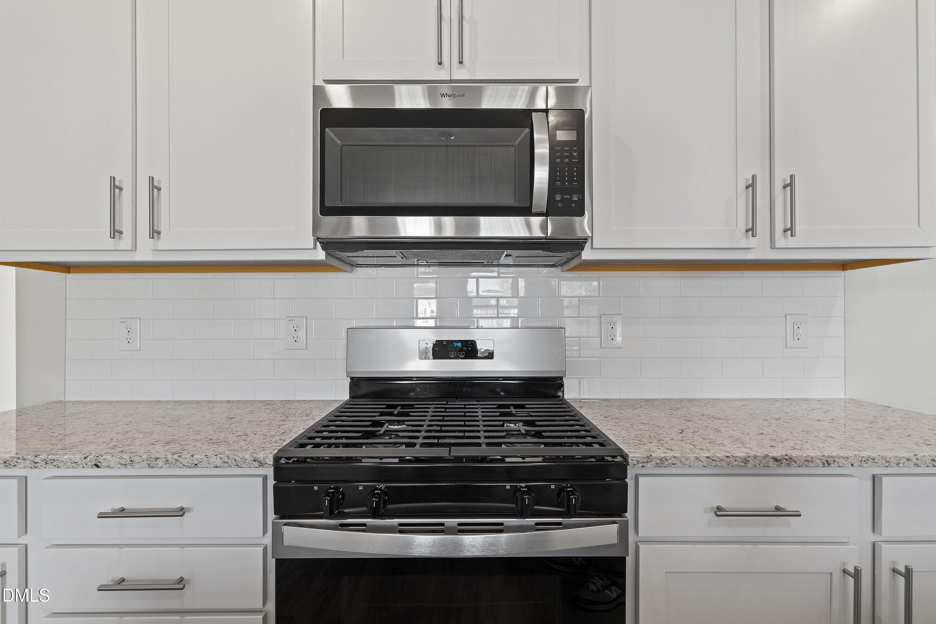 7242 Morris Acres Road Apex, NC 27523 - Photo 8 of 35 a stove top oven sitting inside of a kitchen