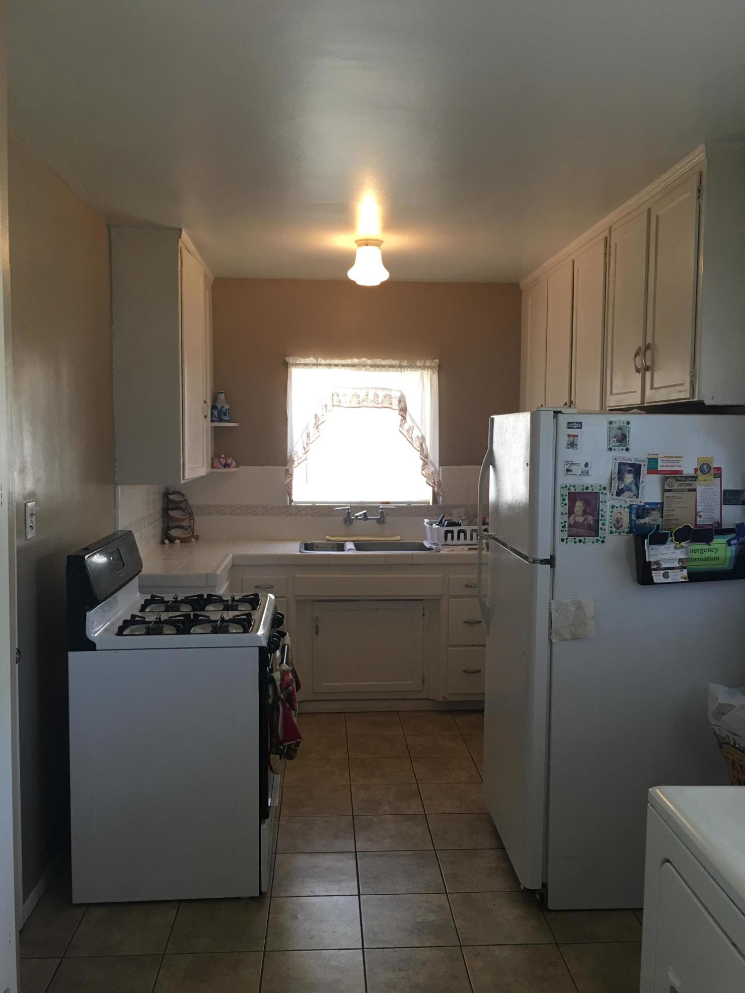 5441 Challen Avenue Riverside, CA 92503 - Photo 5 of 10 a kitchen with a sink and cabinets