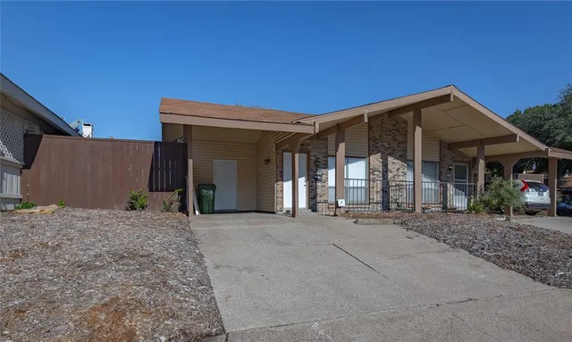 a view of a house with roof and porch