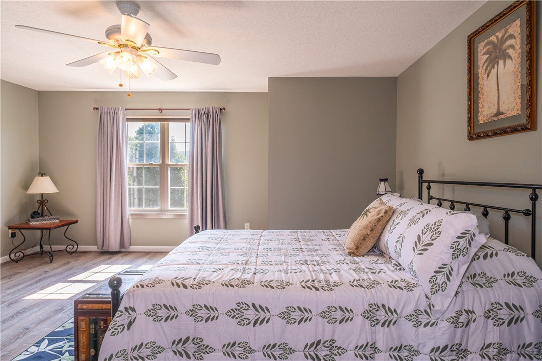 10765 Stone Ridge Way Harrison, OH 45030 - Photo 23 of 68 Sun-filled primary bedroom with a window offering ample natural light and a ceiling fan for comfort.