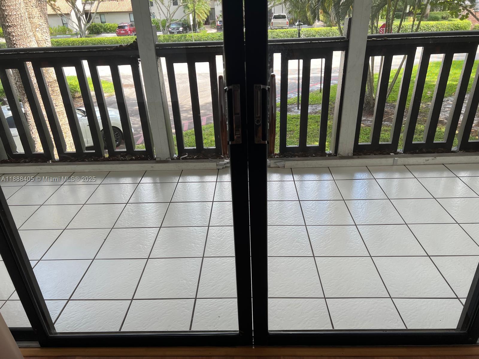 1021 Mockingbird Lane, Unit 209 Plantation, FL 33324 - Photo 19 of 26 a view of a black gate