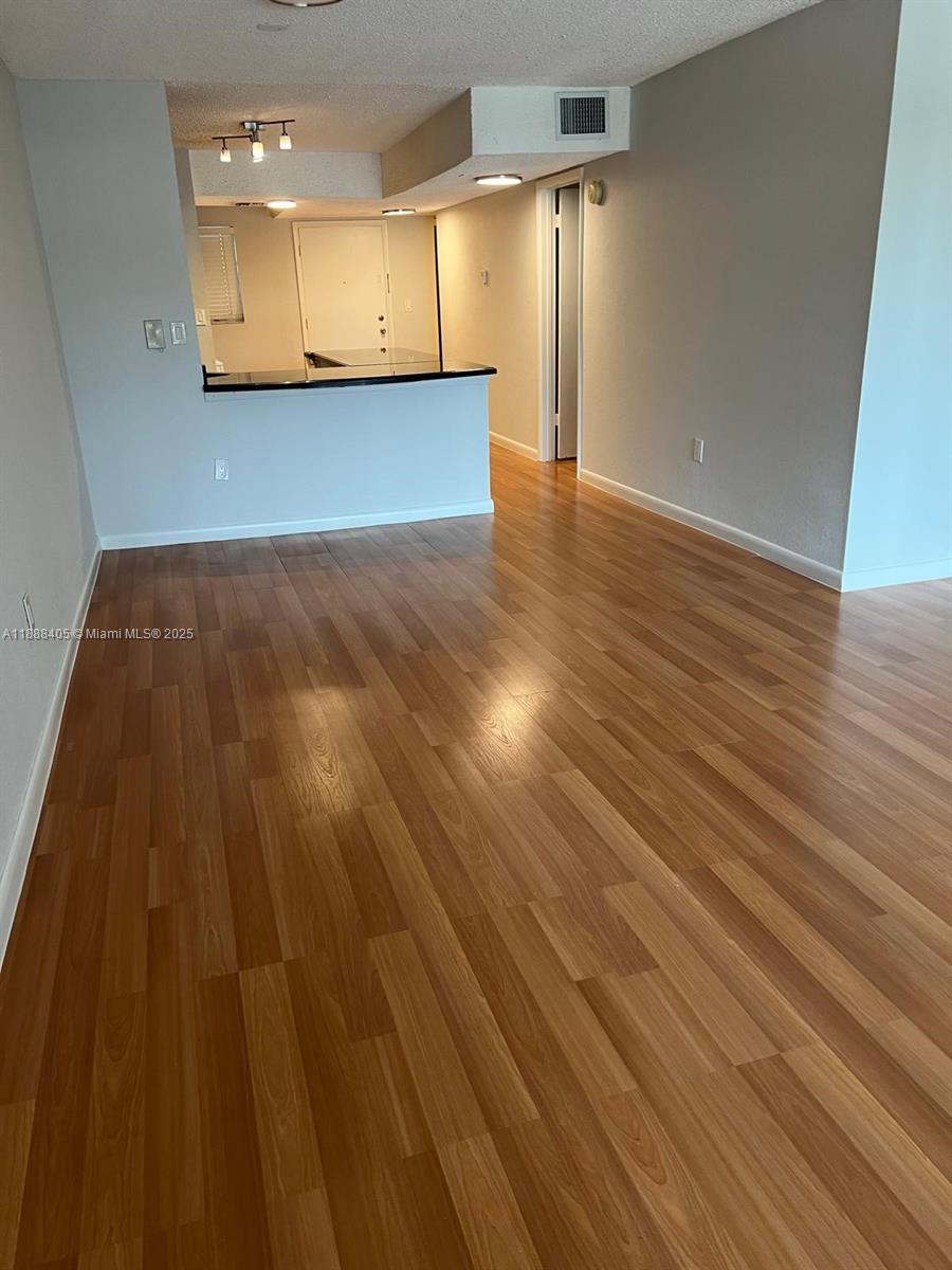 1021 Mockingbird Lane, Unit 209 Plantation, FL 33324 - Photo 5 of 26 a view of a room with wooden floor
