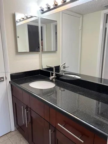 a kitchen with a sink and a microwave