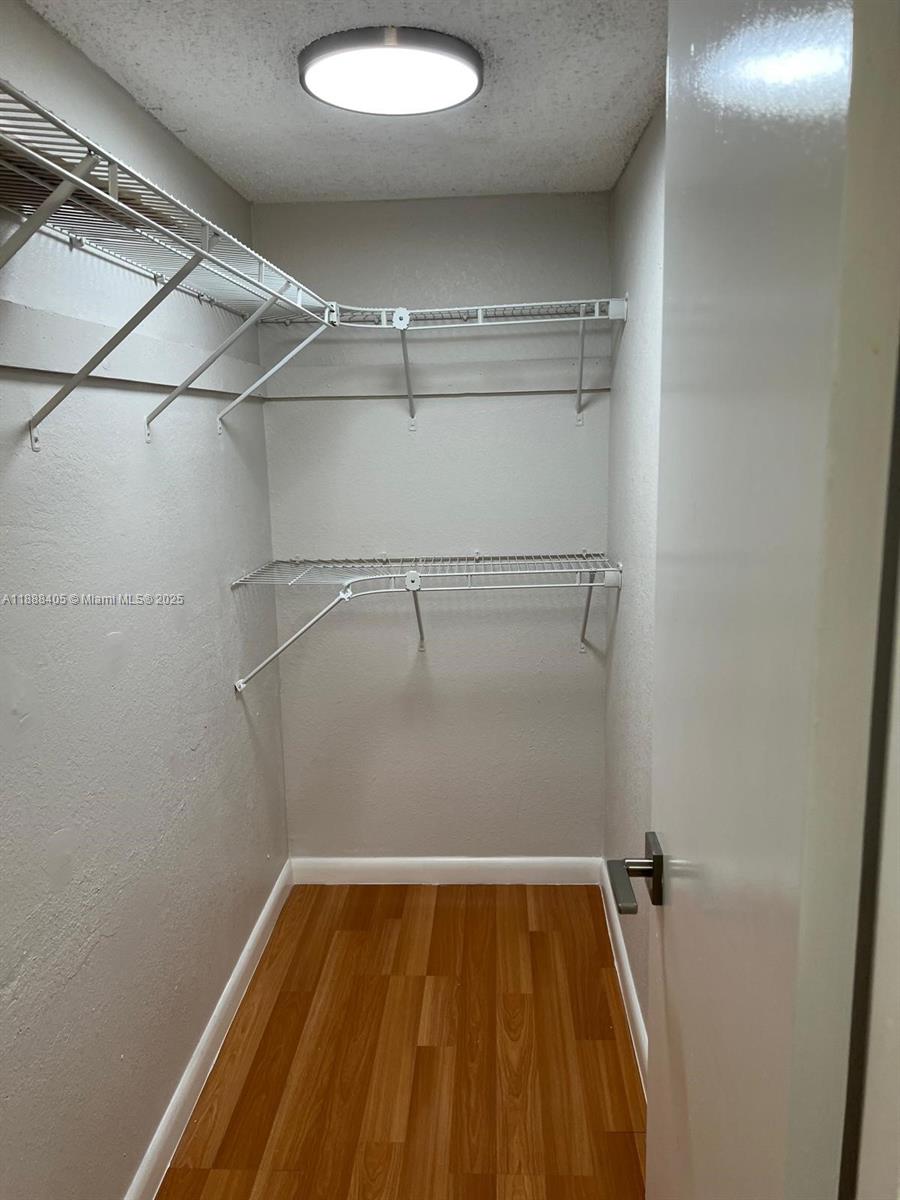 1021 Mockingbird Lane, Unit 209 Plantation, FL 33324 - Photo 8 of 26 a view of a room with racks on the wall