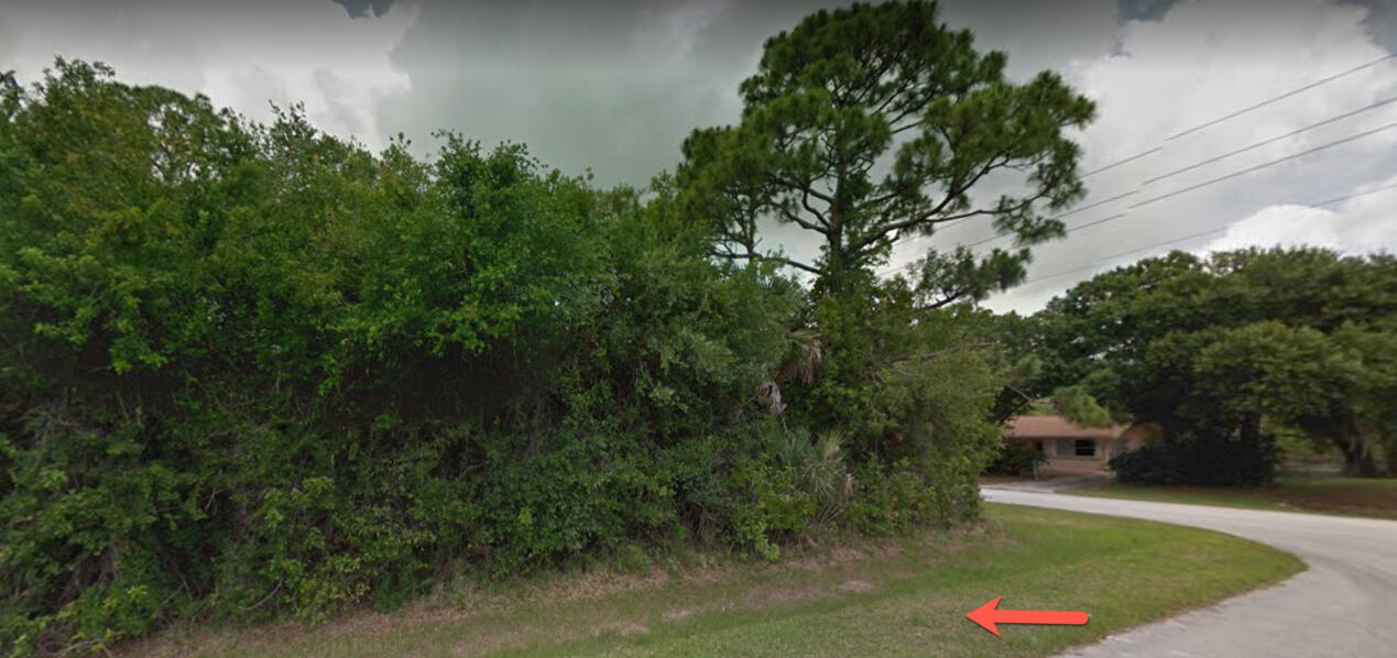 6113 Spring Garden Place Fort Pierce, FL 34951 - Photo 4 of 6 an aerial view of a house