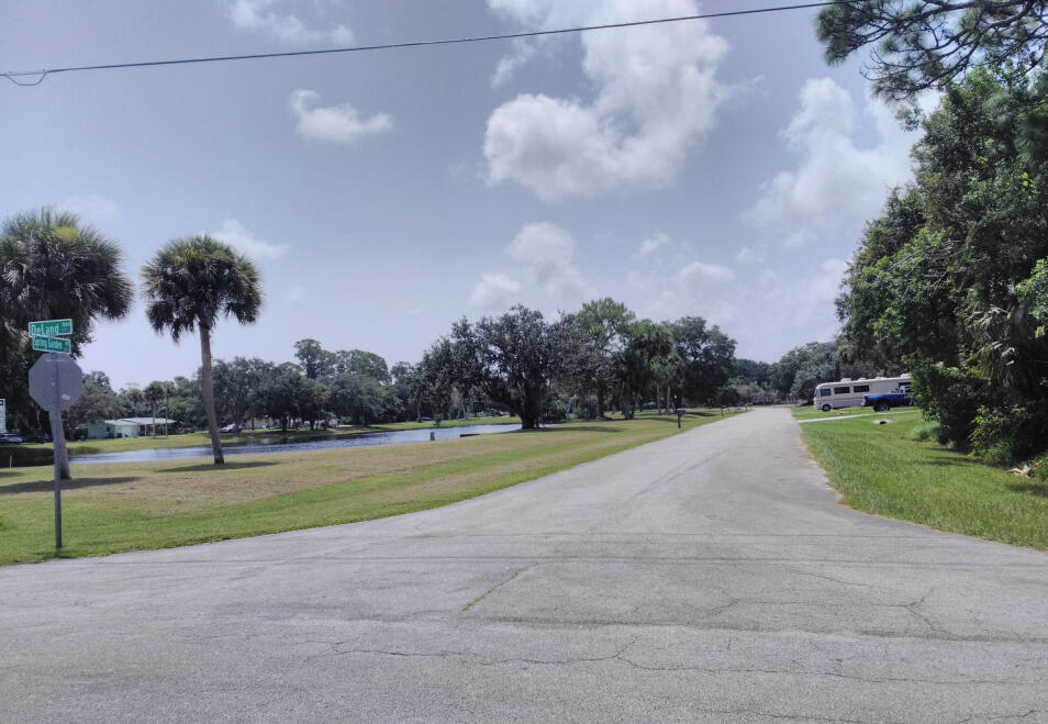 6113 Spring Garden Place Fort Pierce, FL 34951 - Photo 6 of 6 a view of a playground and basketball court