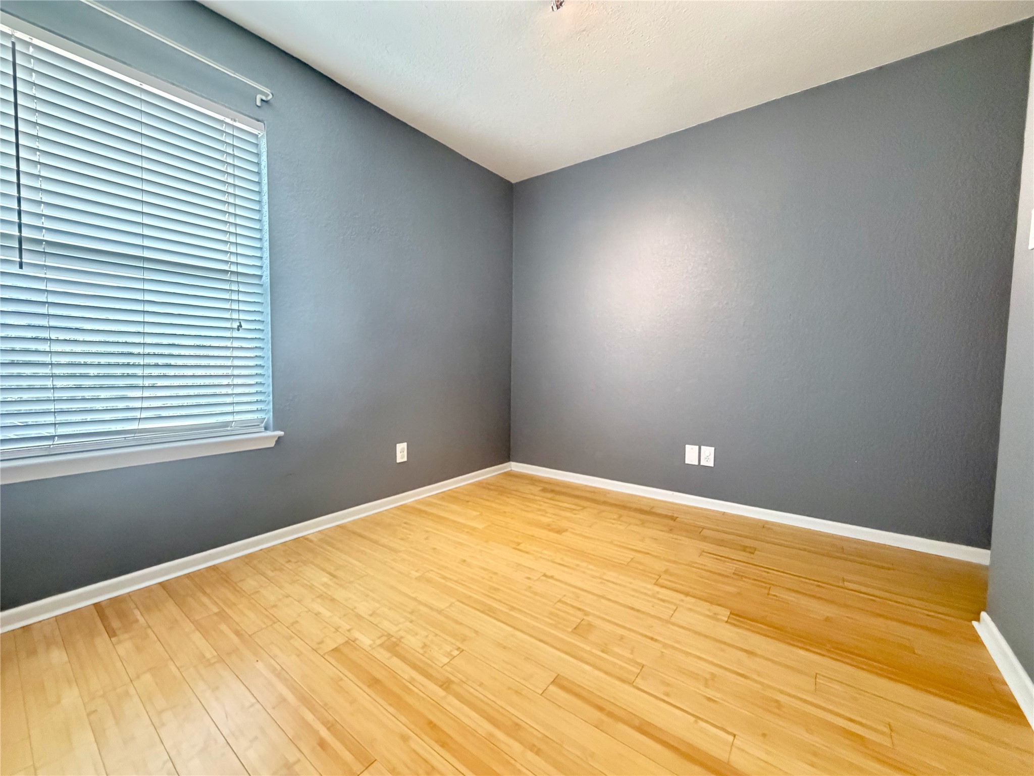 3204 Manchaca Road, Unit 302 Austin, TX 78704 - Photo 10 of 20 Gleaming hardwood floors and a large window define this versatile interior space.