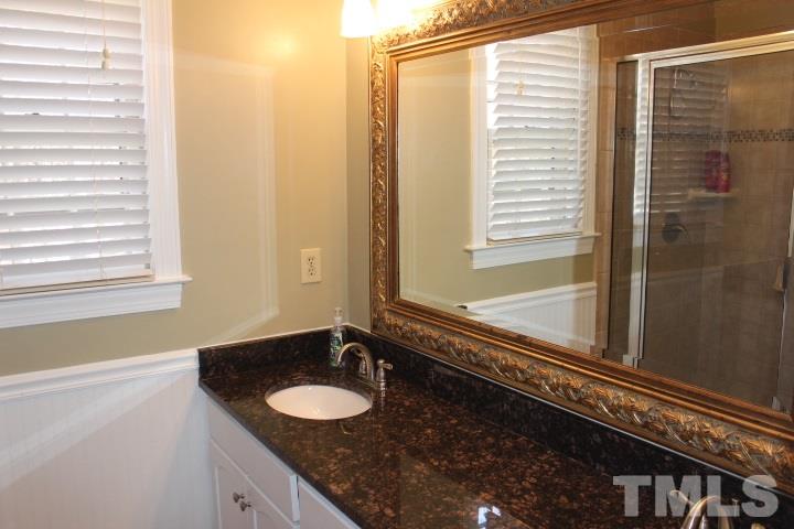 2205 Millpine Drive Raleigh, NC 27614 - Photo 13 of 22 Updated master bath with granite counter tops, updated tile floors and shower.