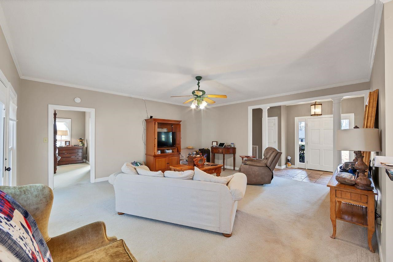242 Liberty Claybrook Road Beech Bluff, TN 38313 - Photo 10 of 23 a living room with furniture and a chandelier