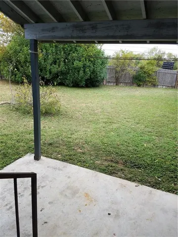 a view of a back yard from a balcony