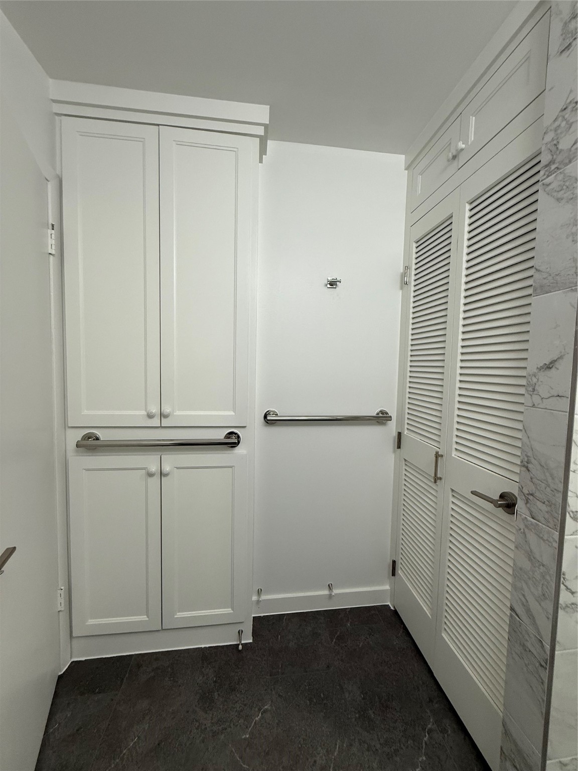 4040 San Felipe Street, Unit 247 Houston, TX 77027 - Photo 15 of 29 Secondary bath washer/dryer closet and extra storage cabinets