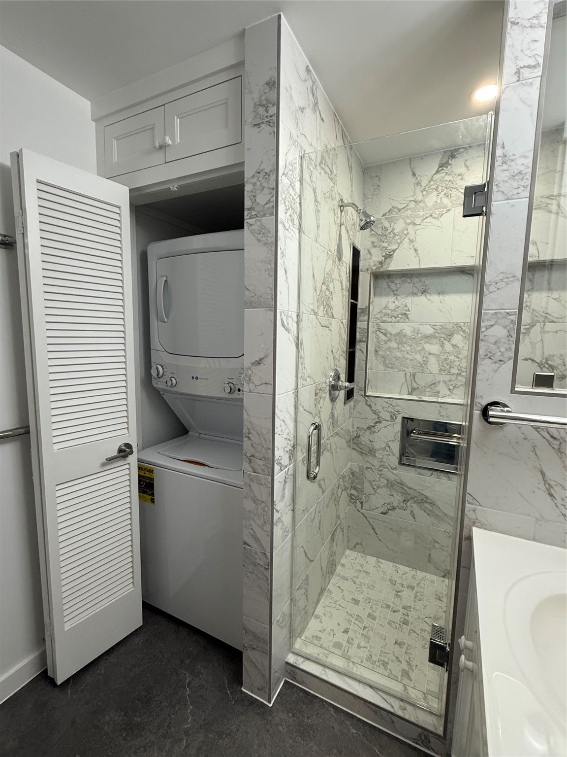 4040 San Felipe Street, Unit 247 Houston, TX 77027 - Photo 16 of 29 Stacked washer/dryer