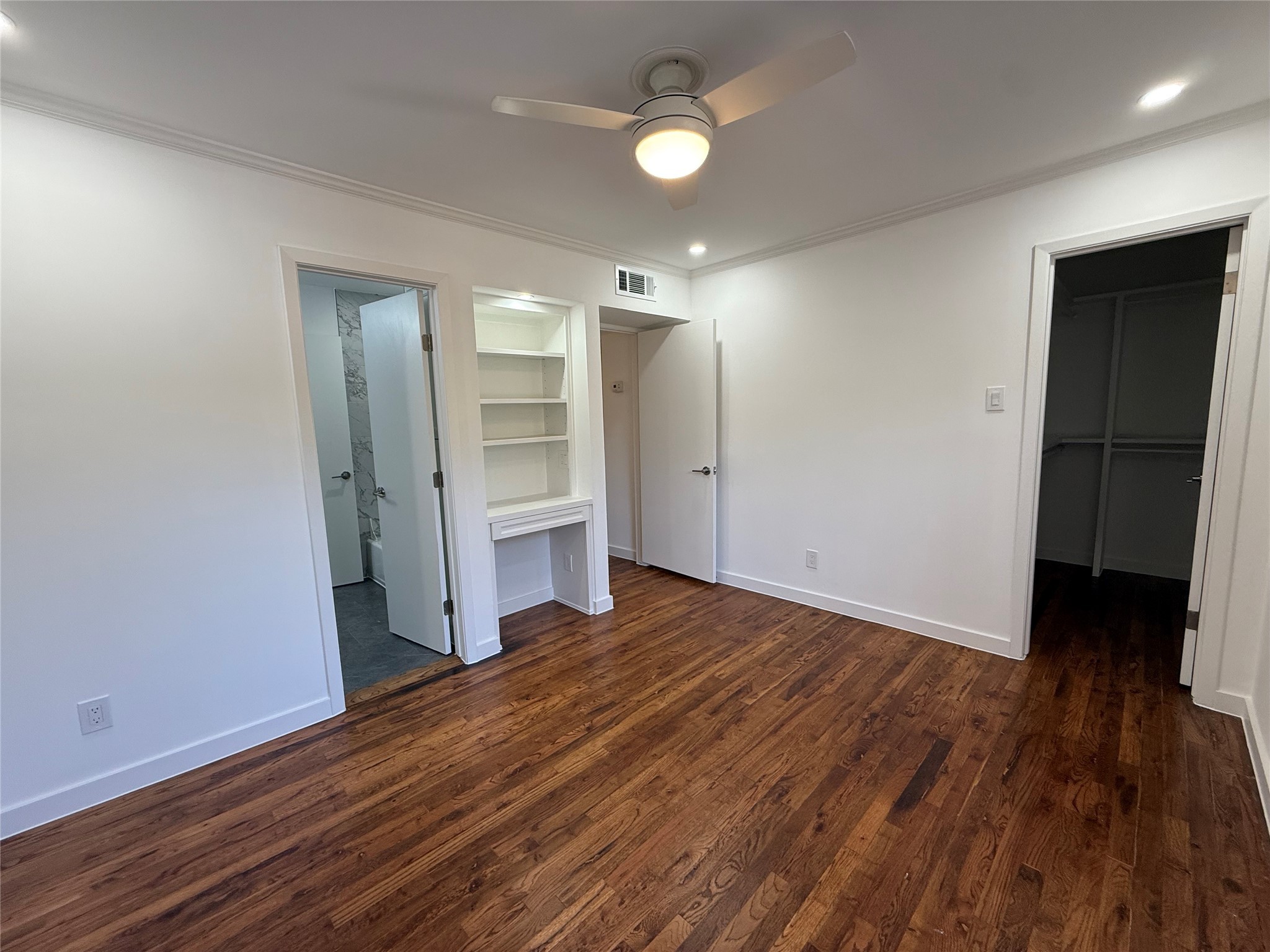 4040 San Felipe Street, Unit 247 Houston, TX 77027 - Photo 17 of 29 Bedroom with walk-in closet and built-in desk