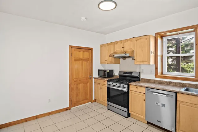 a view of a brick house with wooden floor