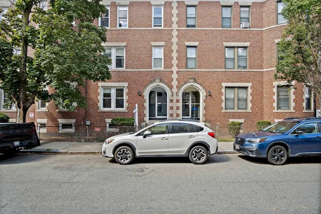 a cars parked in front of a building