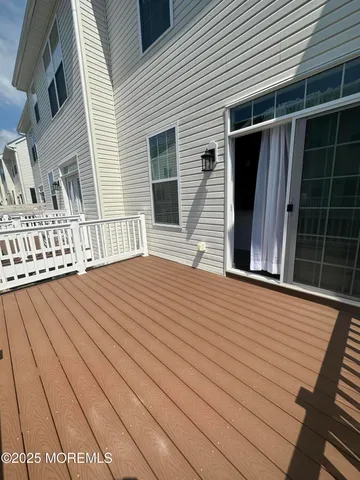 a balcony view with a wooden floor