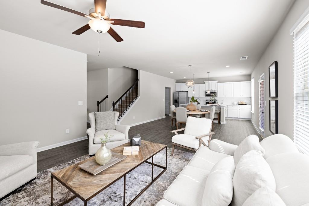 7 Purackal Lane Statham, GA 30666 - Photo 11 of 57 a living room with furniture and kitchen view