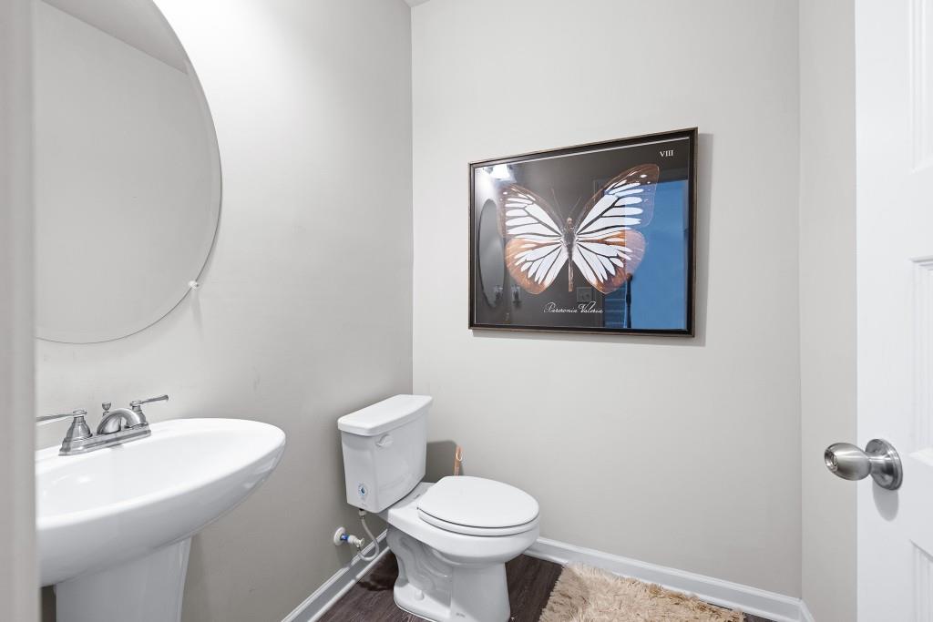 7 Purackal Lane Statham, GA 30666 - Photo 24 of 57 a bathroom with a toilet a sink and mirror