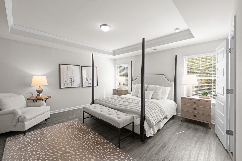 7 Purackal Lane Statham, GA 30666 - Photo 27 of 57 a bedroom with a bed and a couch