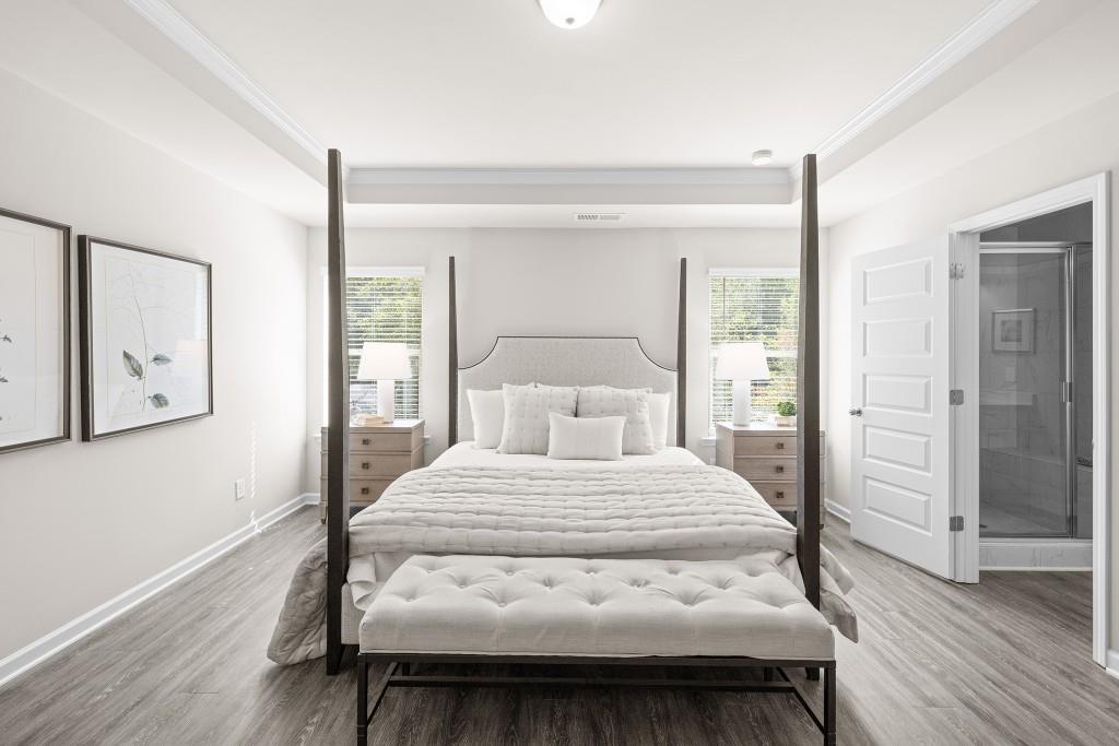 7 Purackal Lane Statham, GA 30666 - Photo 28 of 57 a bedroom with a bed and wooden floor
