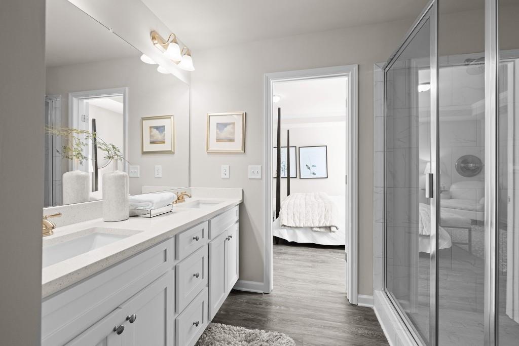 7 Purackal Lane Statham, GA 30666 - Photo 32 of 57 a spacious bathroom with a granite countertop sink a mirror and a shower