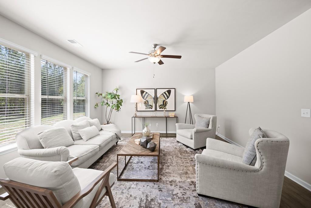 7 Purackal Lane Statham, GA 30666 - Photo 9 of 57 a living room with furniture a table and a large window