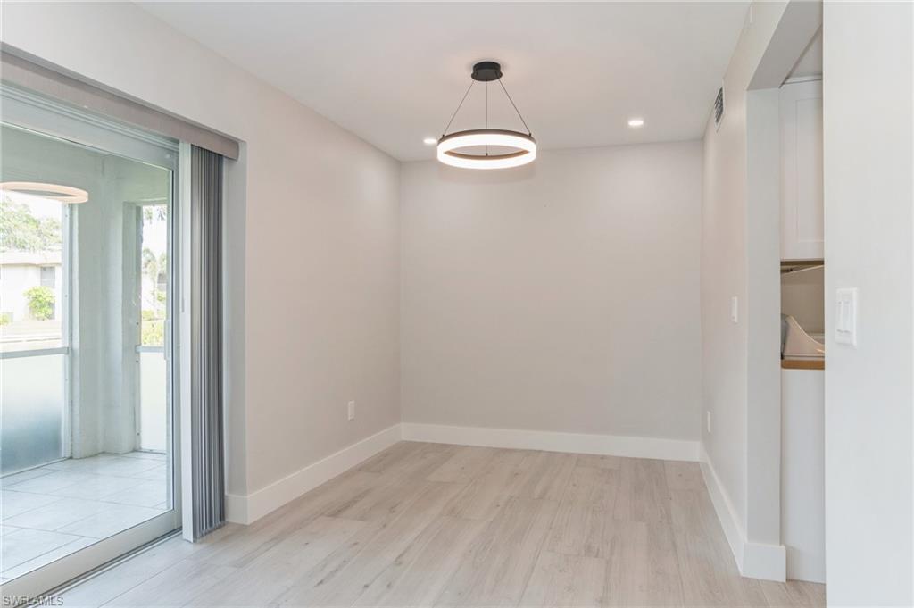1155 Sandpiper Street, Unit B3 Naples, FL 34102 - Photo 6 of 21 Unfurnished dining area featuring light wood-style floors and recessed lighting