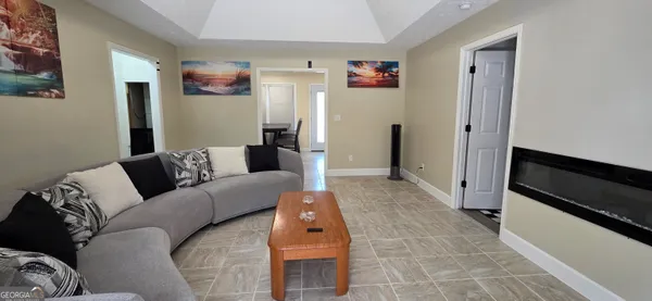a living room with furniture and a rug