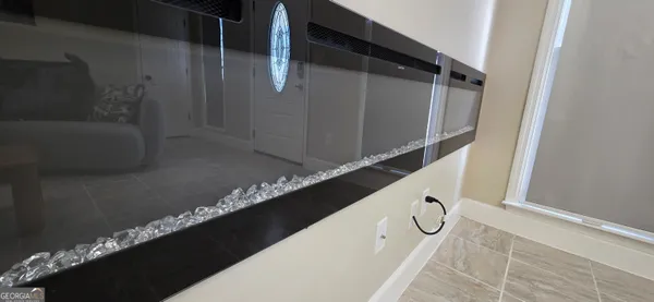 a living room with furniture and a rug