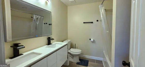 a bathroom with a sink and a toilet