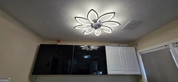a view of living room and kitchen with furniture