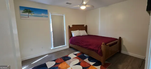 a front view of house with yard outdoor seating and barbeque oven