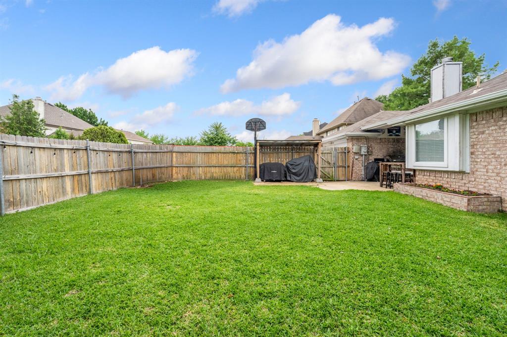2302 Randi Road Rowlett, TX 75088 - Photo 27 of 33 a view of a backyard with a garden