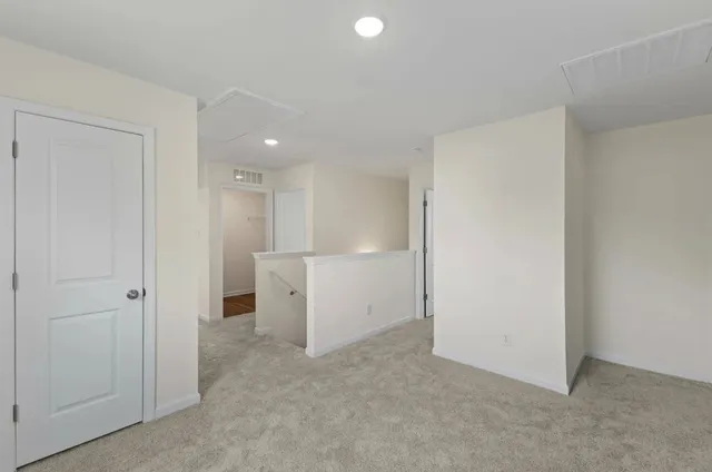 a living room with furniture and windows