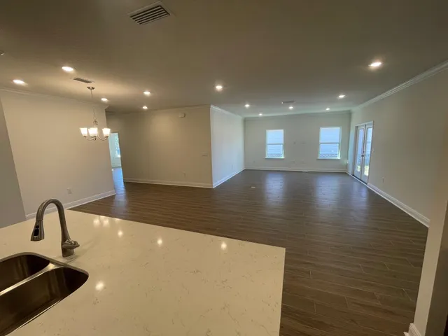a view of a big room with wooden floor
