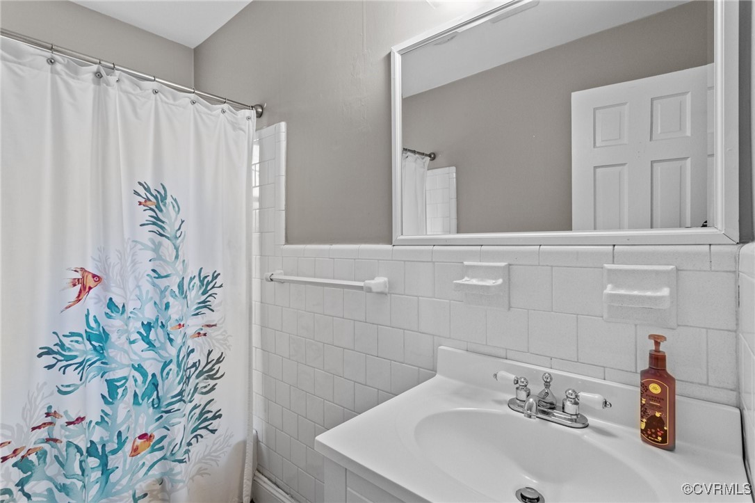 10507 Gayton Road Henrico, VA 23238 - Photo 15 of 47 Bathroom featuring tile walls, a shower with curta