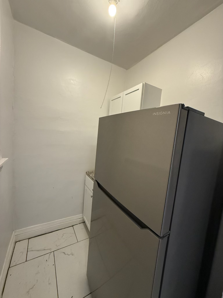 6928 South Green Street, Unit 1S Chicago, IL 60621 - Photo 7 of 12 a view of refrigerator