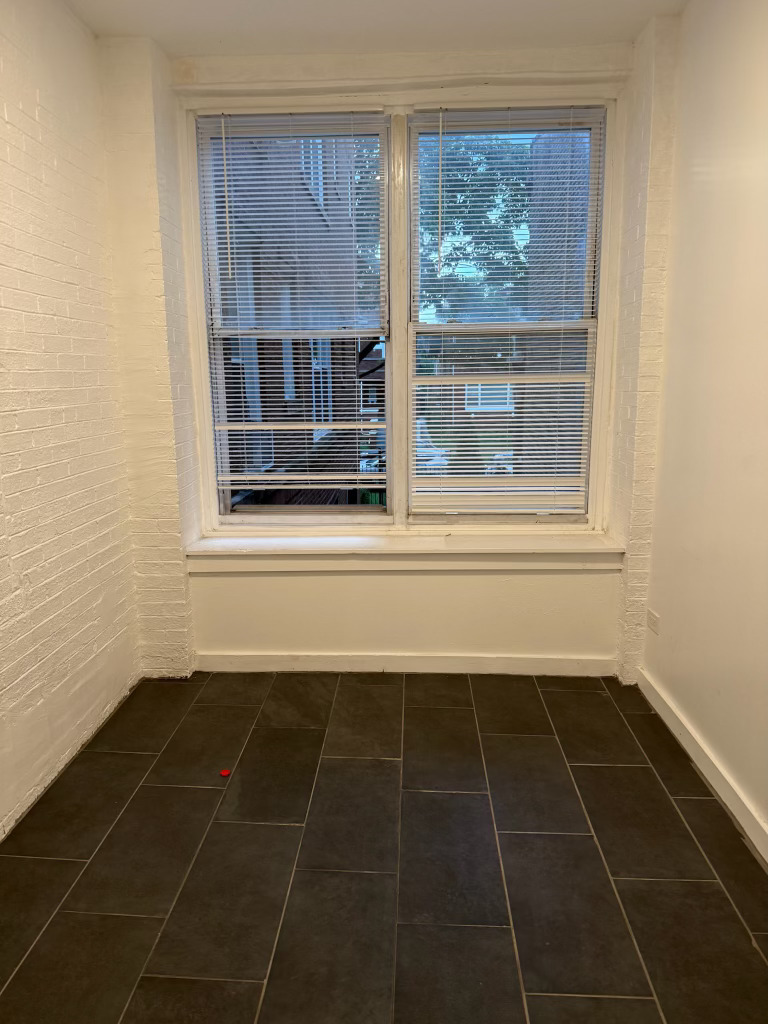 6928 South Green Street, Unit 1S Chicago, IL 60621 - Photo 8 of 12 a view of a door with a glass door