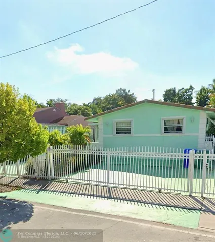 a view of a balcony and yard
