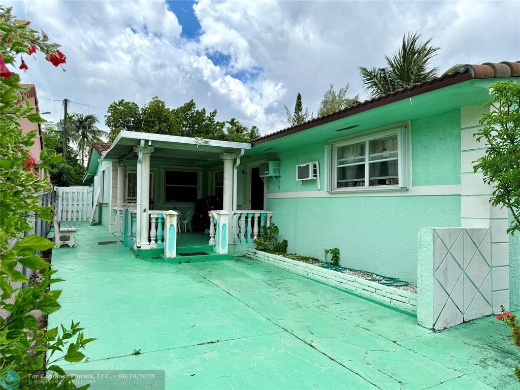 430 Northeast 75th Street Miami, FL 33138 - Photo 5 of 11 a view of house with backyard porch and entertaining space