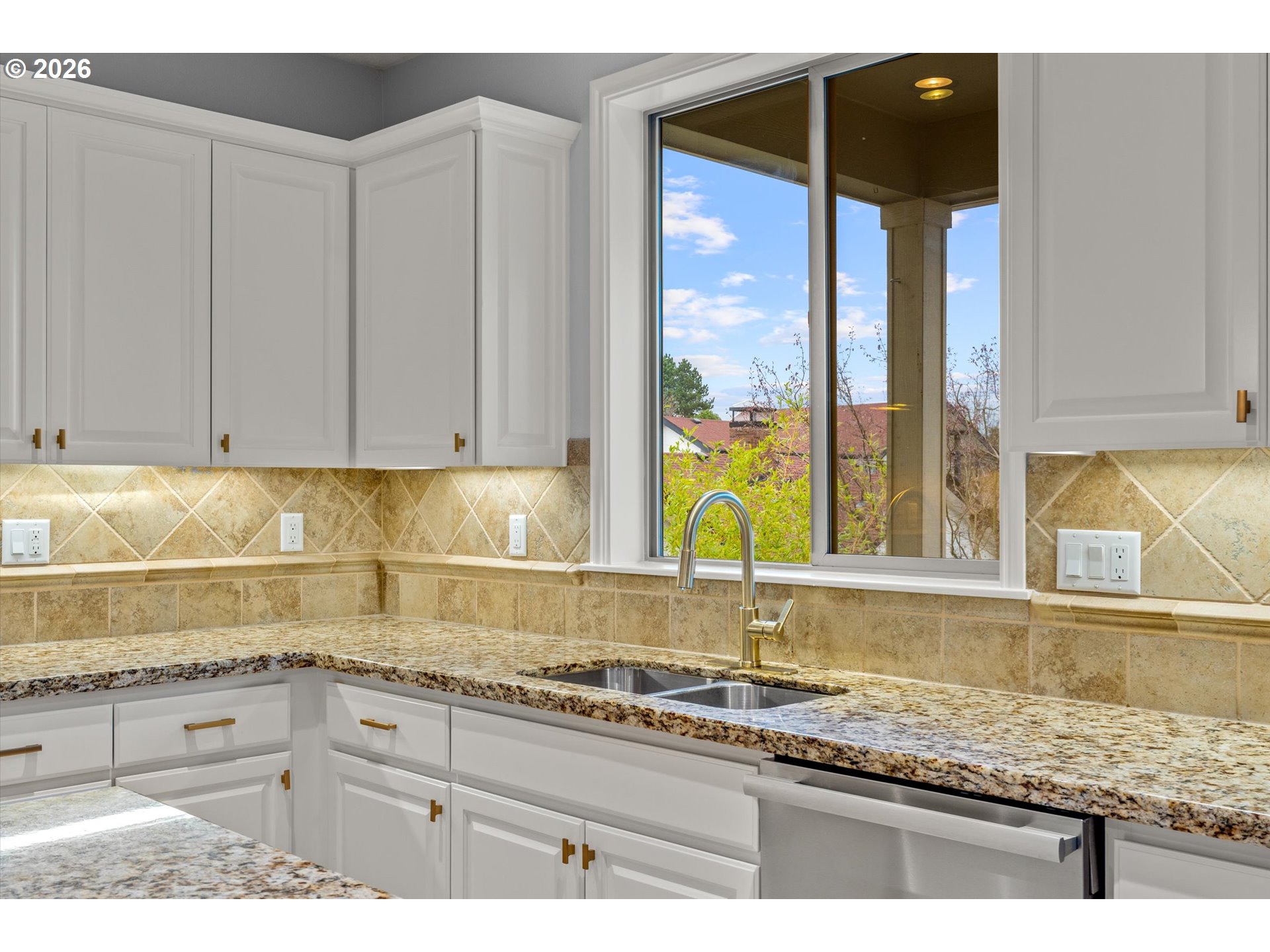 12059 Southwest Stringer Lane Tigard, OR 97224 - Photo 12 of 41 a kitchen with granite countertop a sink a stove and cabinets